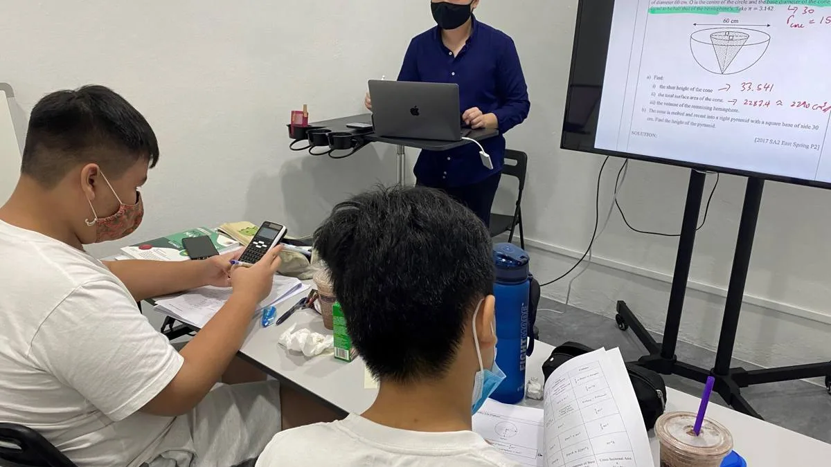 A small secondary math class at Math Vigilante with the tutor at the screen